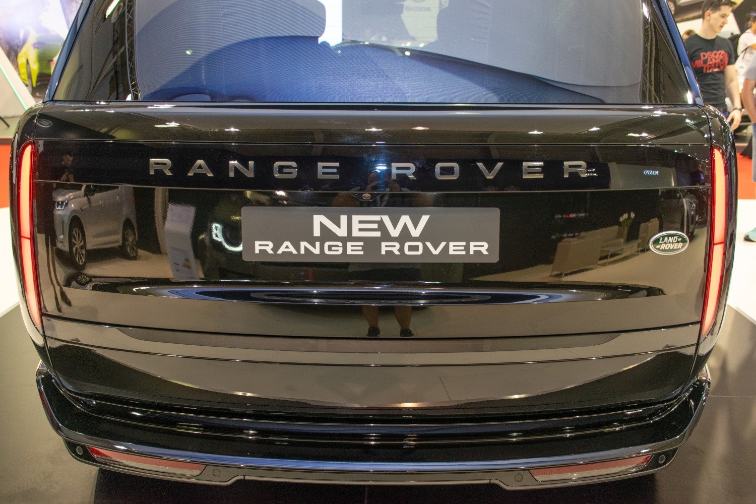 Back of a luxury SUV with vertical LED taillights and bold branding