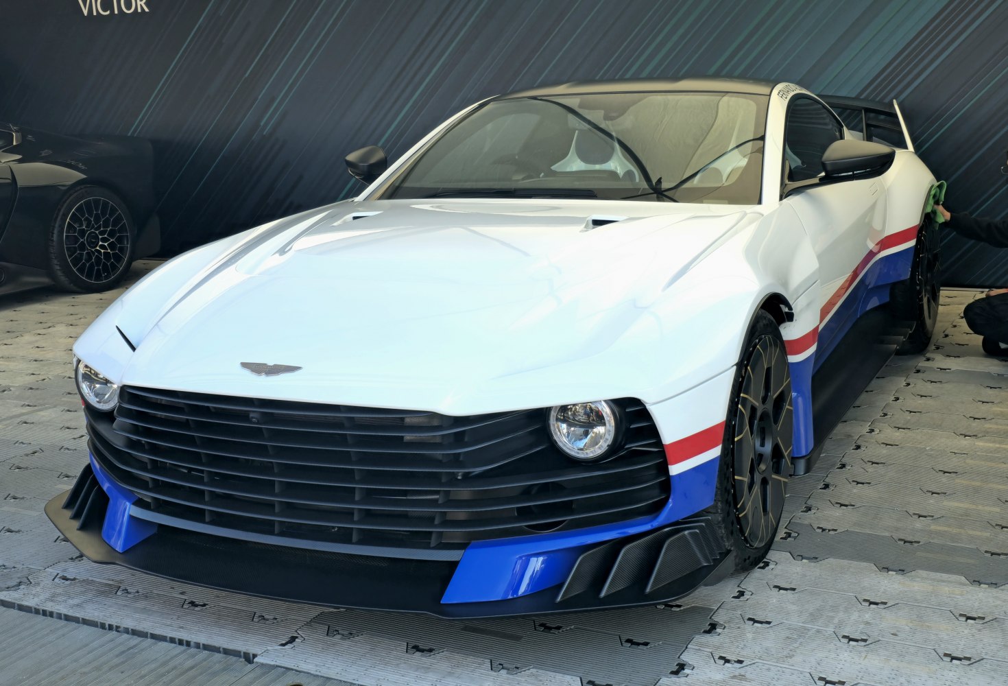 Aggressive front grille with sleek aerodynamic body and sporty design