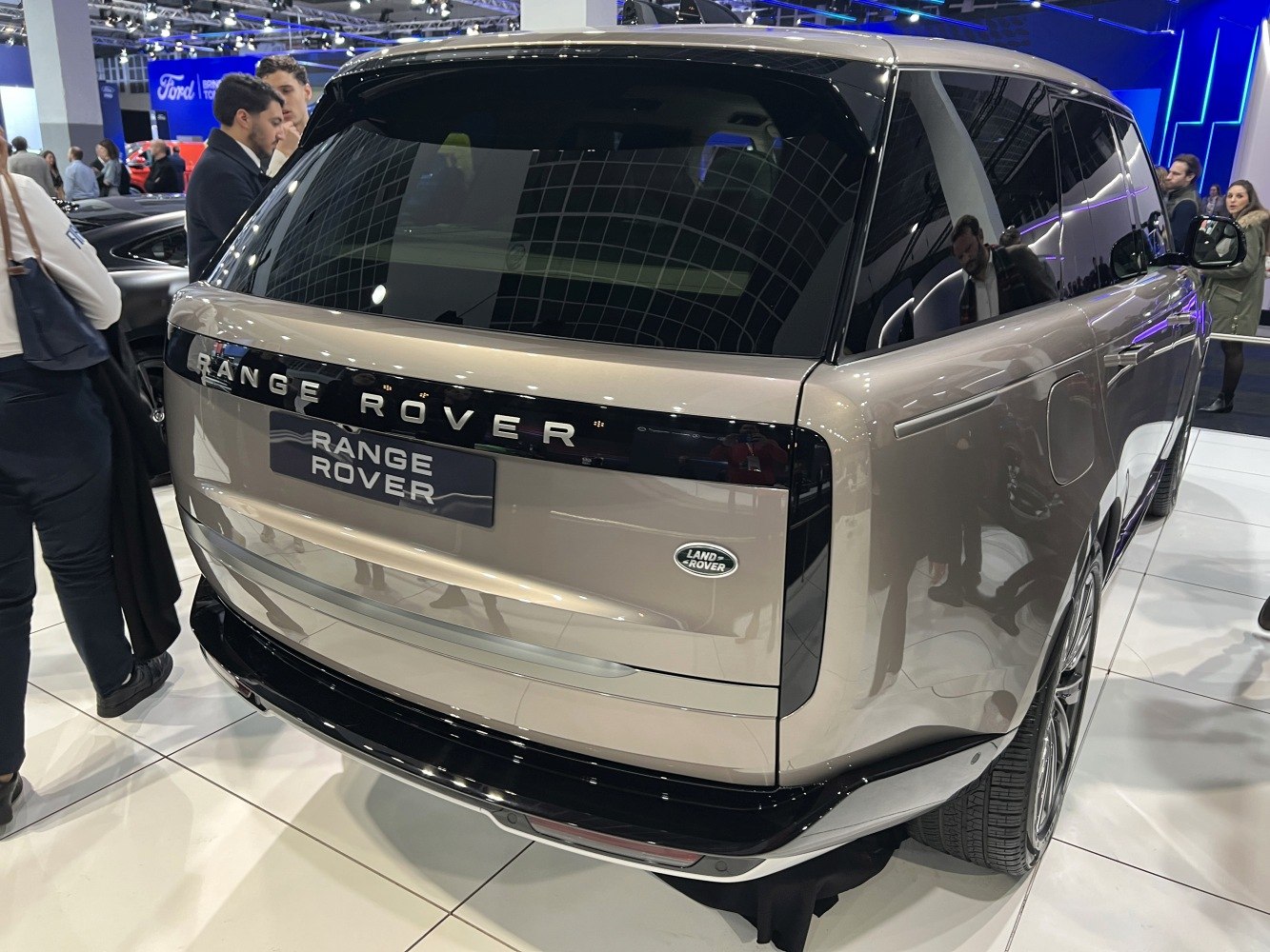 Rear view of a luxury SUV with blacked-out tail panel and sleek design