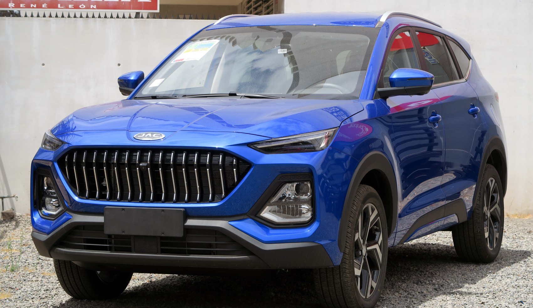 Front view with large grille and sleek LED headlights