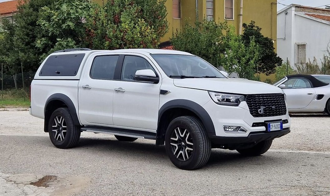 Pickup truck with extended cab and black canopy