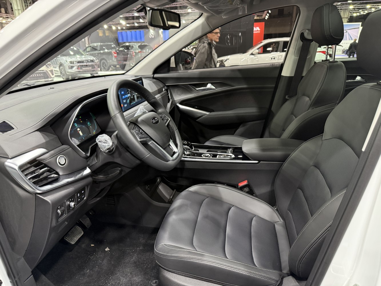 Modern car interior with digital dashboard and leather seats