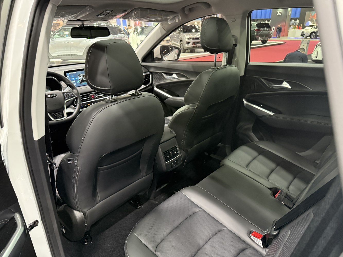 Black leather seats with rear air vents and infotainment display