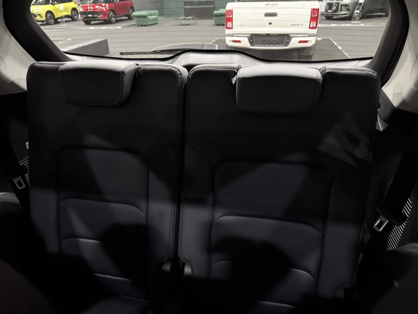 Rear leather seats with headrests in spacious vehicle interior