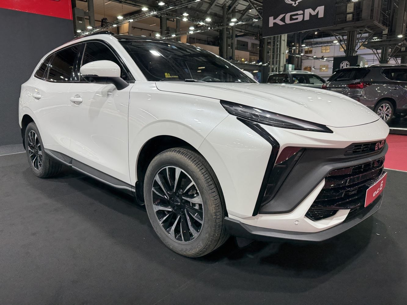 Sleek front grille and sharp modern headlights on a white SUV