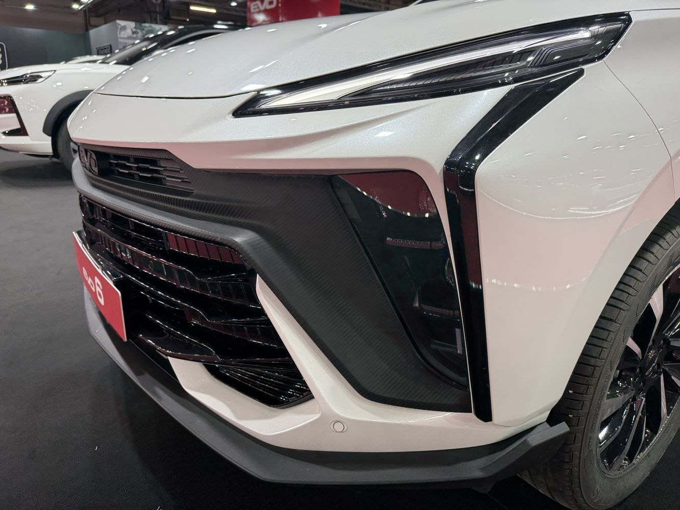 Close-up of front grille and sleek headlight design