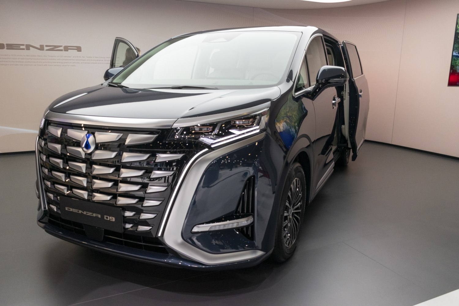 Front grille with chrome accents and LED headlights of a luxury vehicle