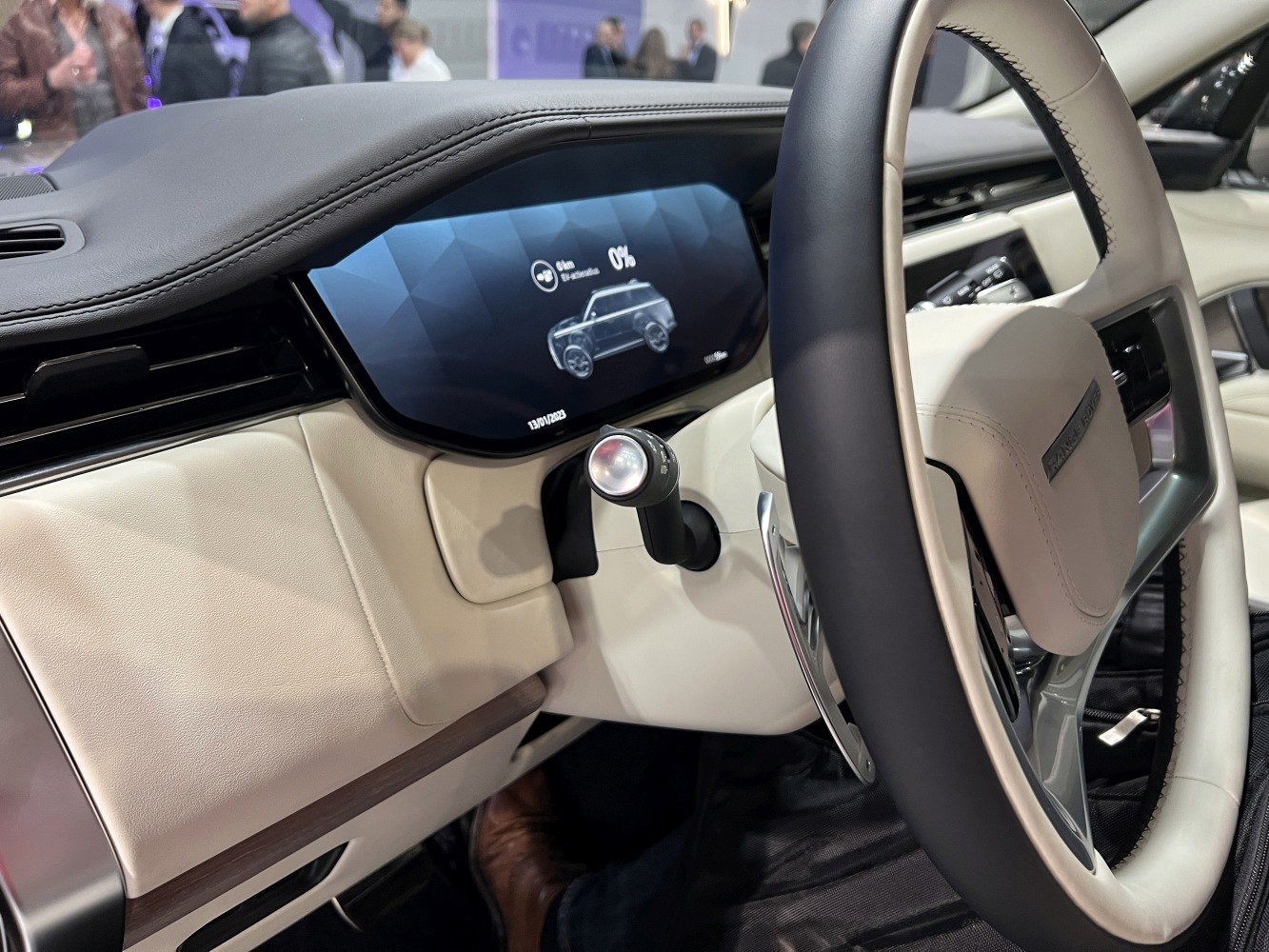 Digital instrument cluster and luxury steering wheel with stitched leather over two tones