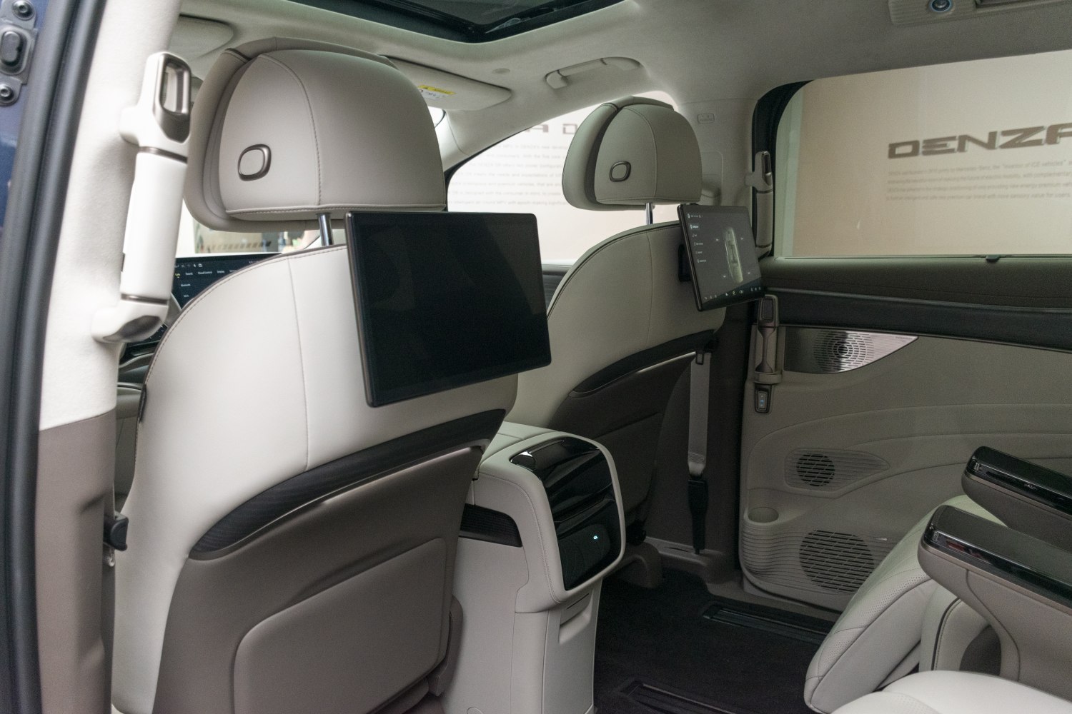 Dual rear entertainment screens and plush leather seating