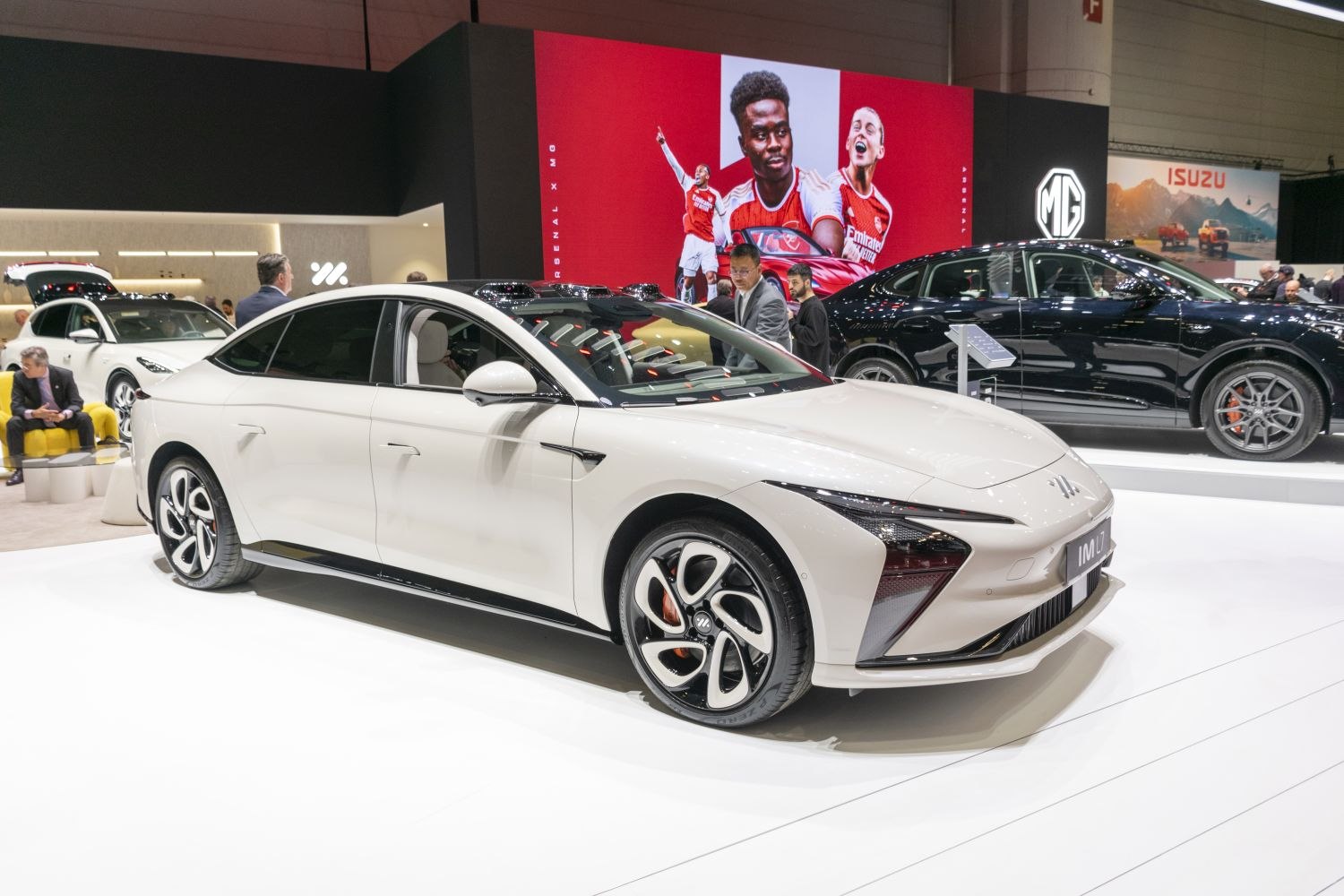 Aerodynamic sedan with sharp LED headlights and distinctive five-spoke alloy wheels.