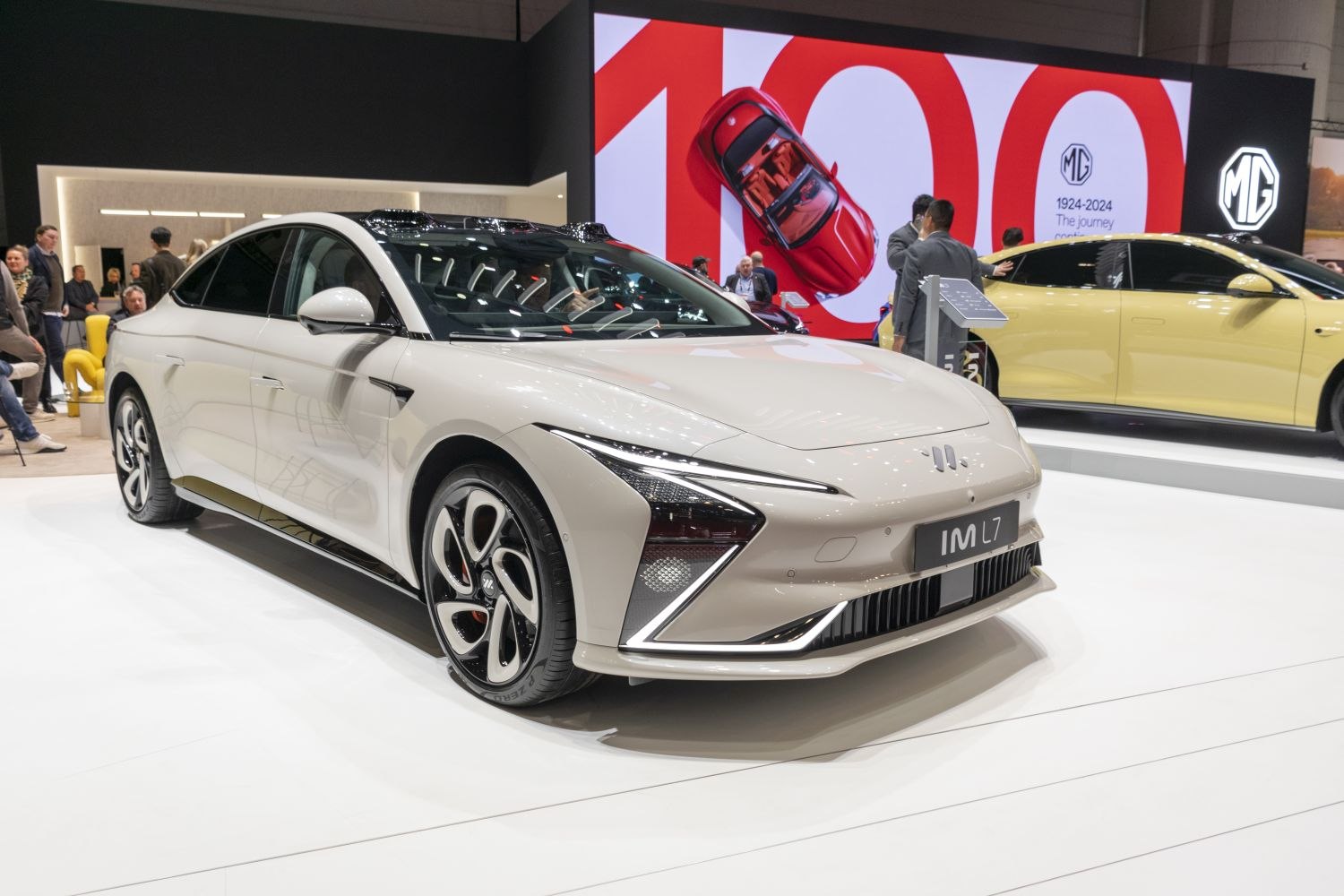 Front-side view of a sleek sedan with LED headlights and modern alloy wheels