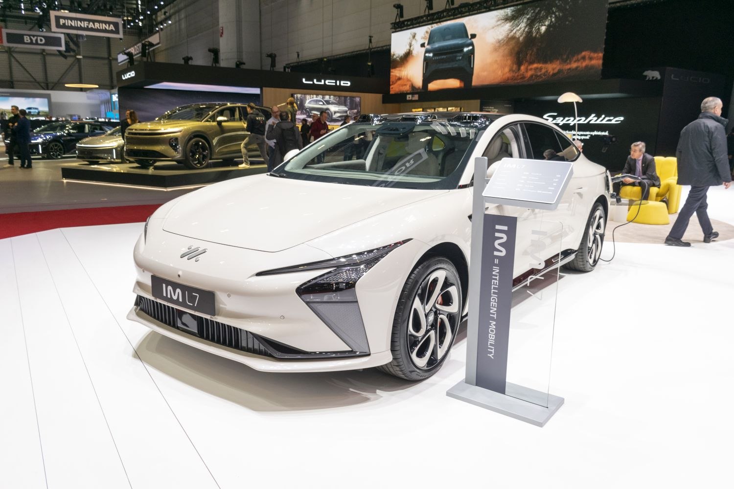 White electric sedan with sharp LED headlights and aerodynamic front design