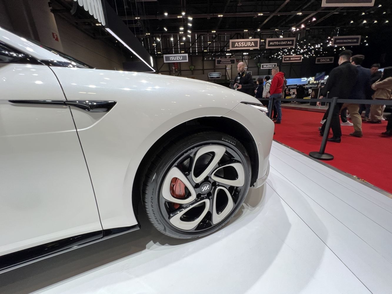Front alloy wheel and red brake caliper close-up