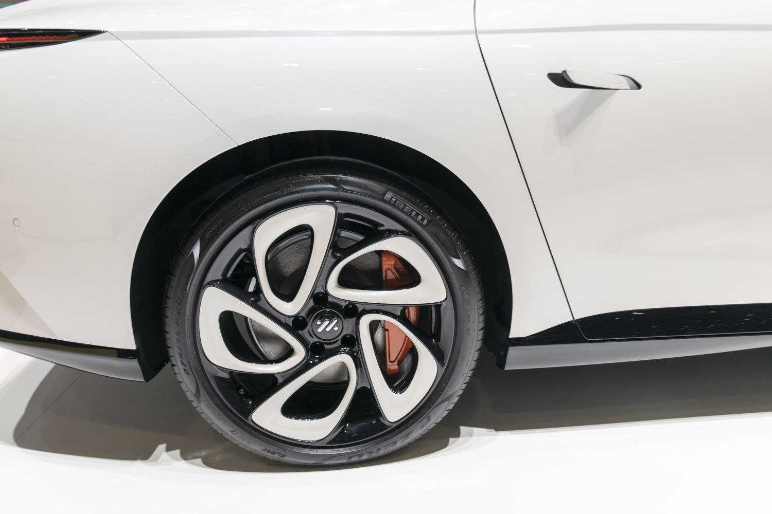 Modern alloy wheel with unique 5-spoke design and flush door handle