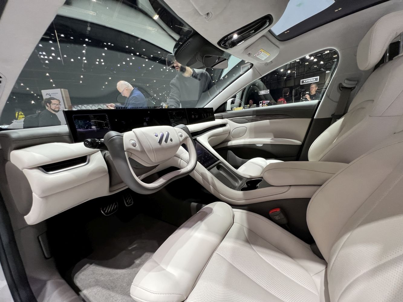 Panoramic digital dashboard and futuristic irregular-shaped steering wheel
