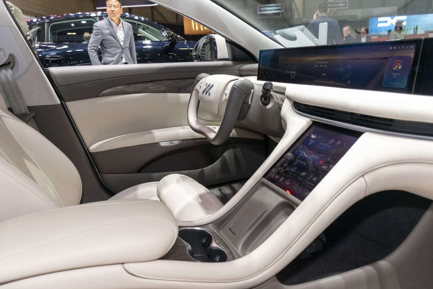Modern interior with dual digital displays and steering yoke