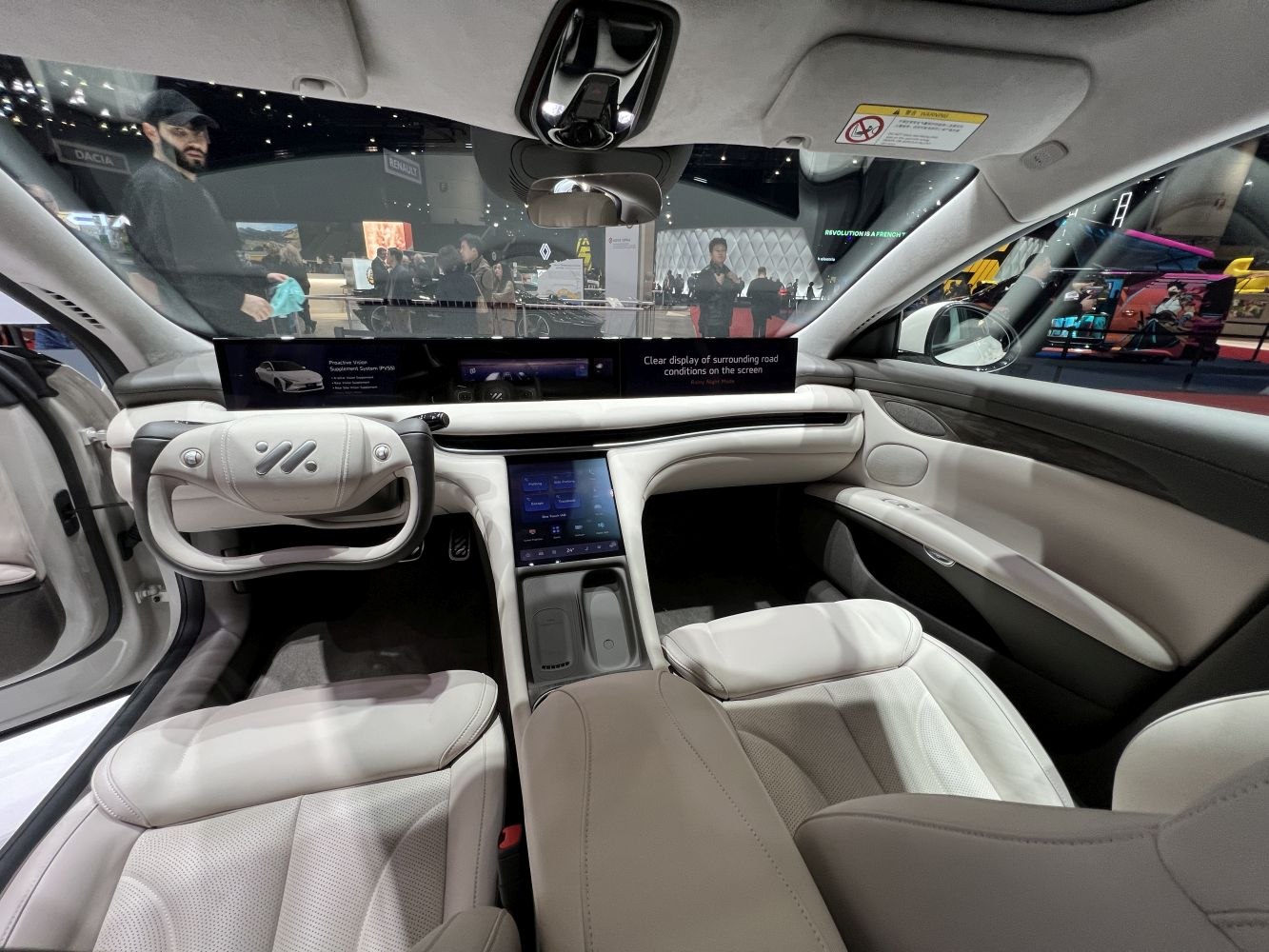 Yoke steering wheel and wide digital display panel in car interior