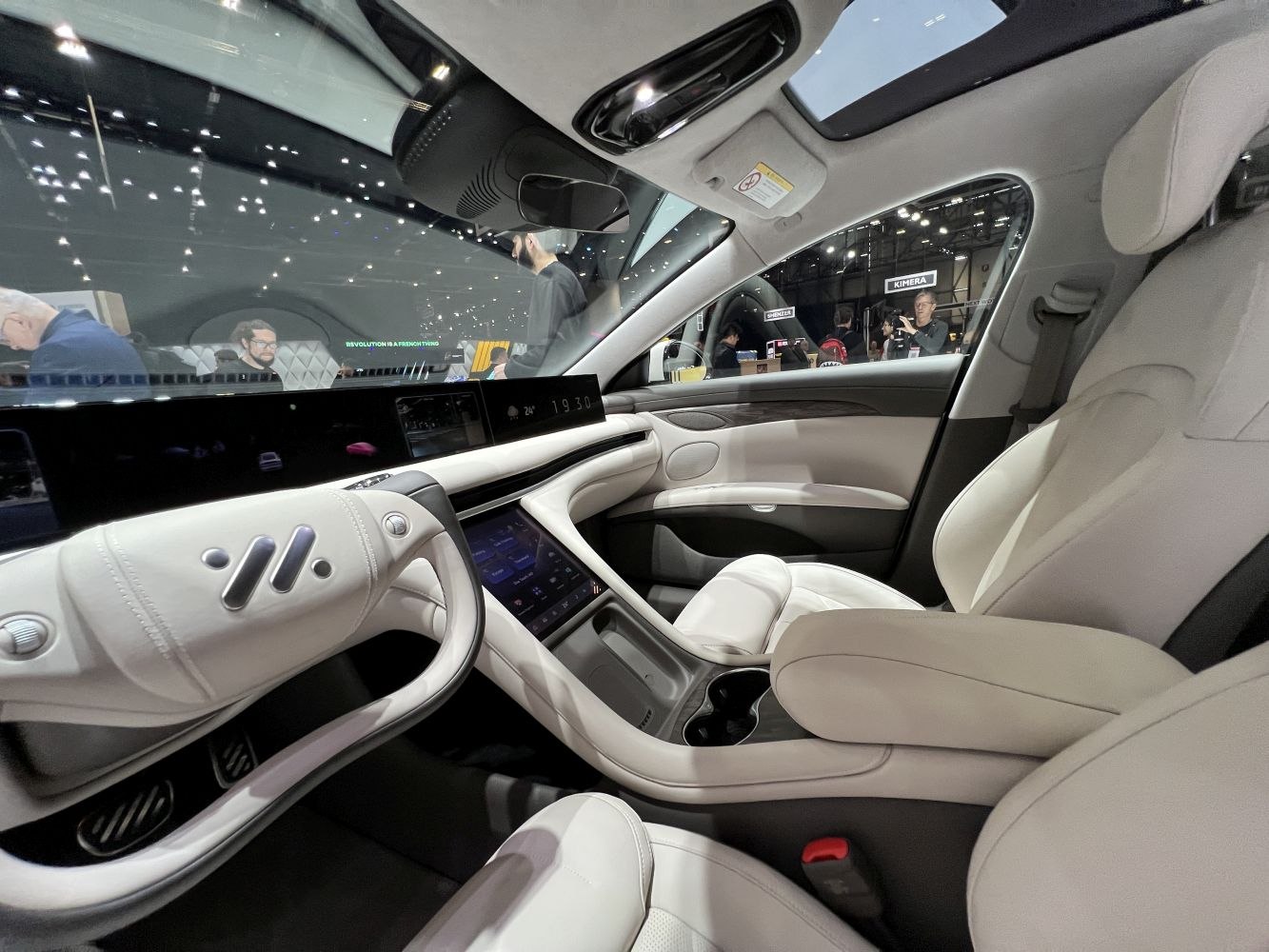 White leather interior with digital dashboard and touchscreen center console