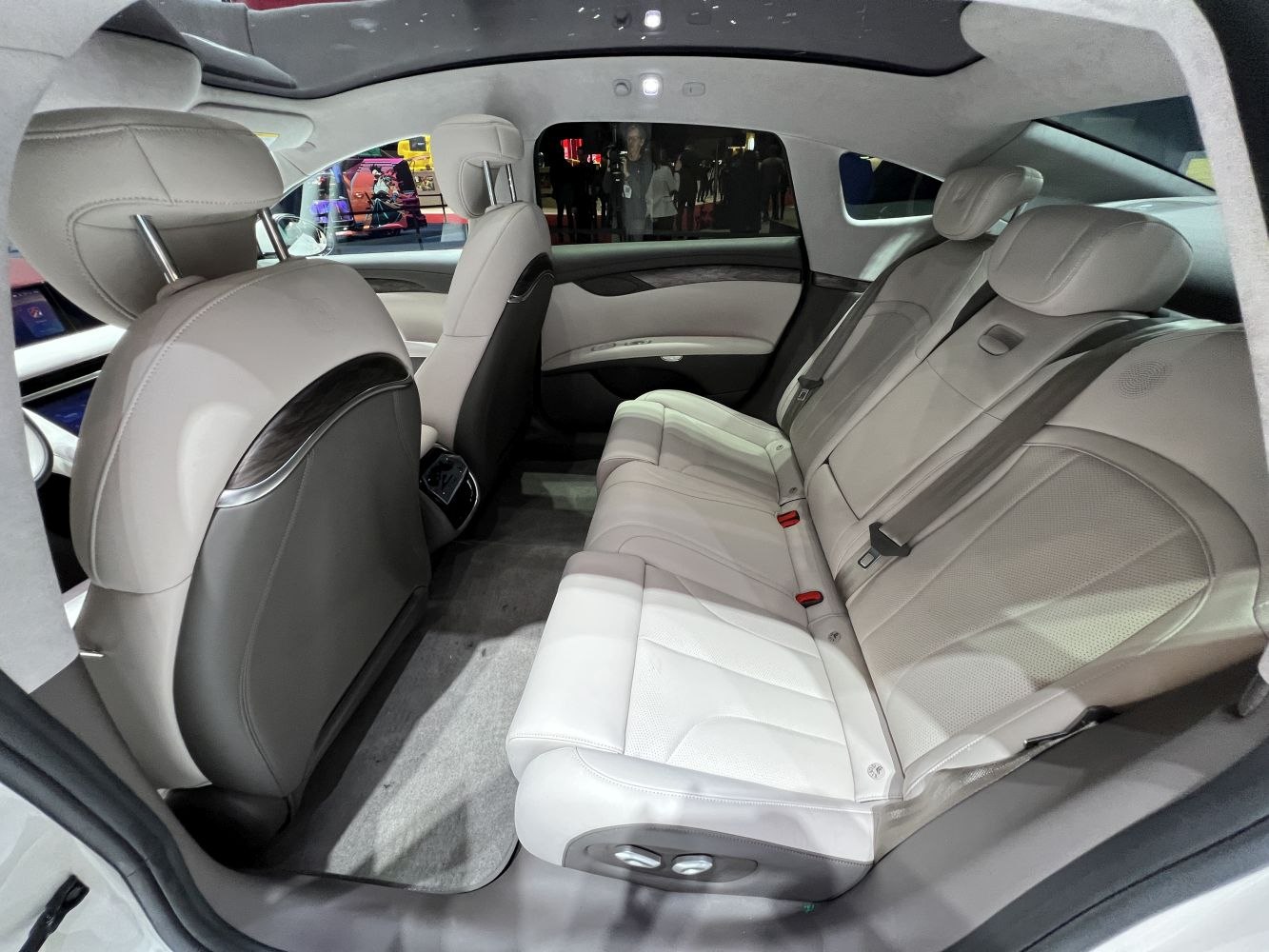 Spacious rear seat area with premium leather upholstery and advanced comfort controls