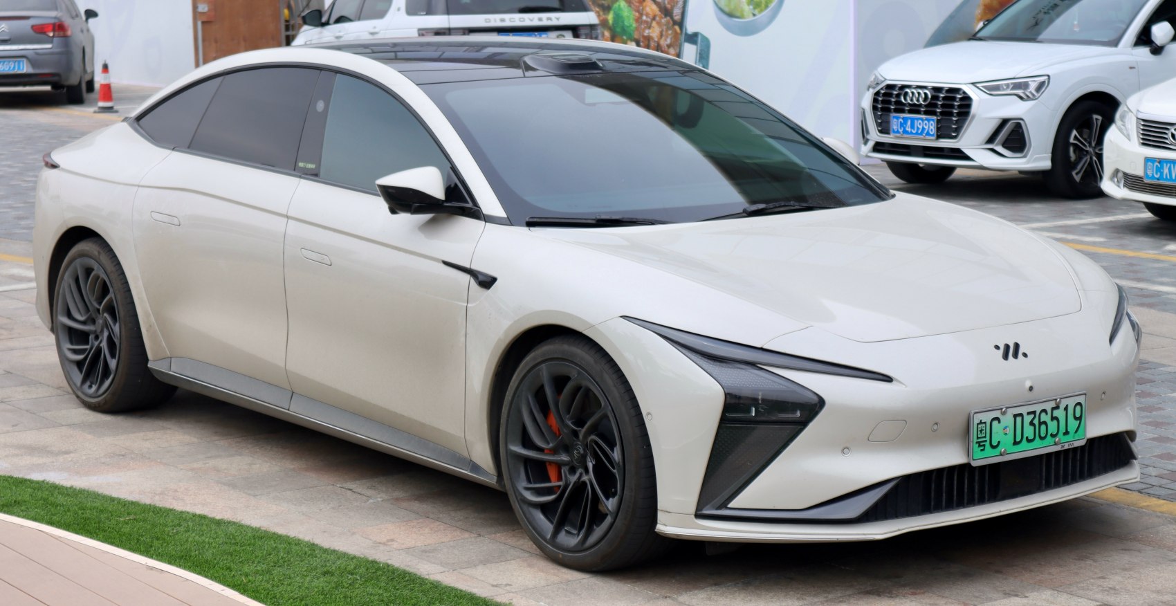 Sleek electric sedan with aerodynamic design and LED headlights
