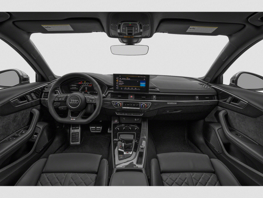 Modern luxury car interior with digital displays and carbon fiber trims