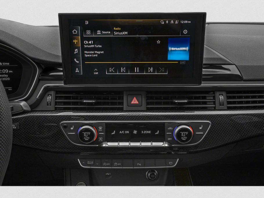 Infotainment touchscreen and 3-zone climate control panel in premium car interior