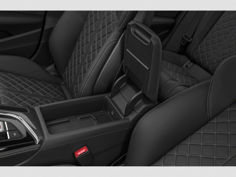 Diamond-stitched leather seats and center console with storage compartment.
