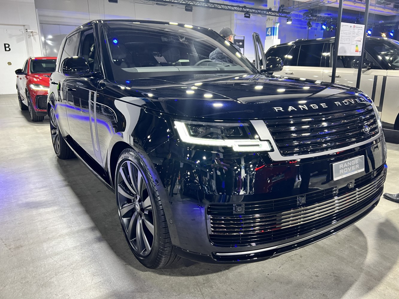 Front view of luxury SUV with LED headlights and sleek grille