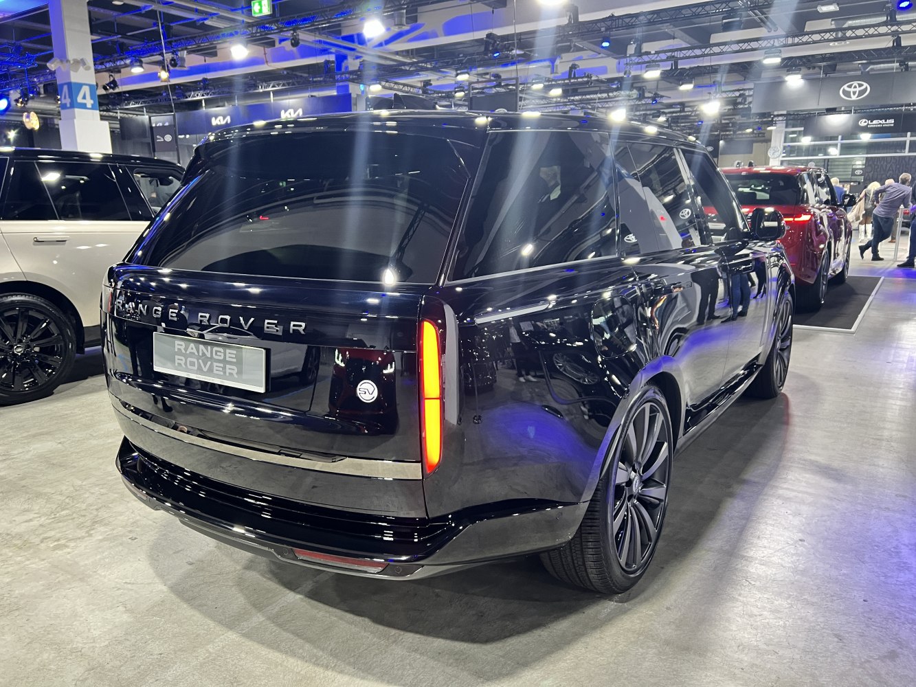 Rear view of luxury SUV with vertical tail lights and sleek black finish