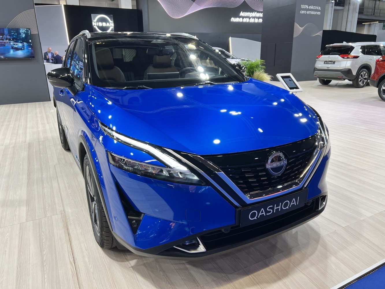 Front view with distinctive LED headlights and bold grille