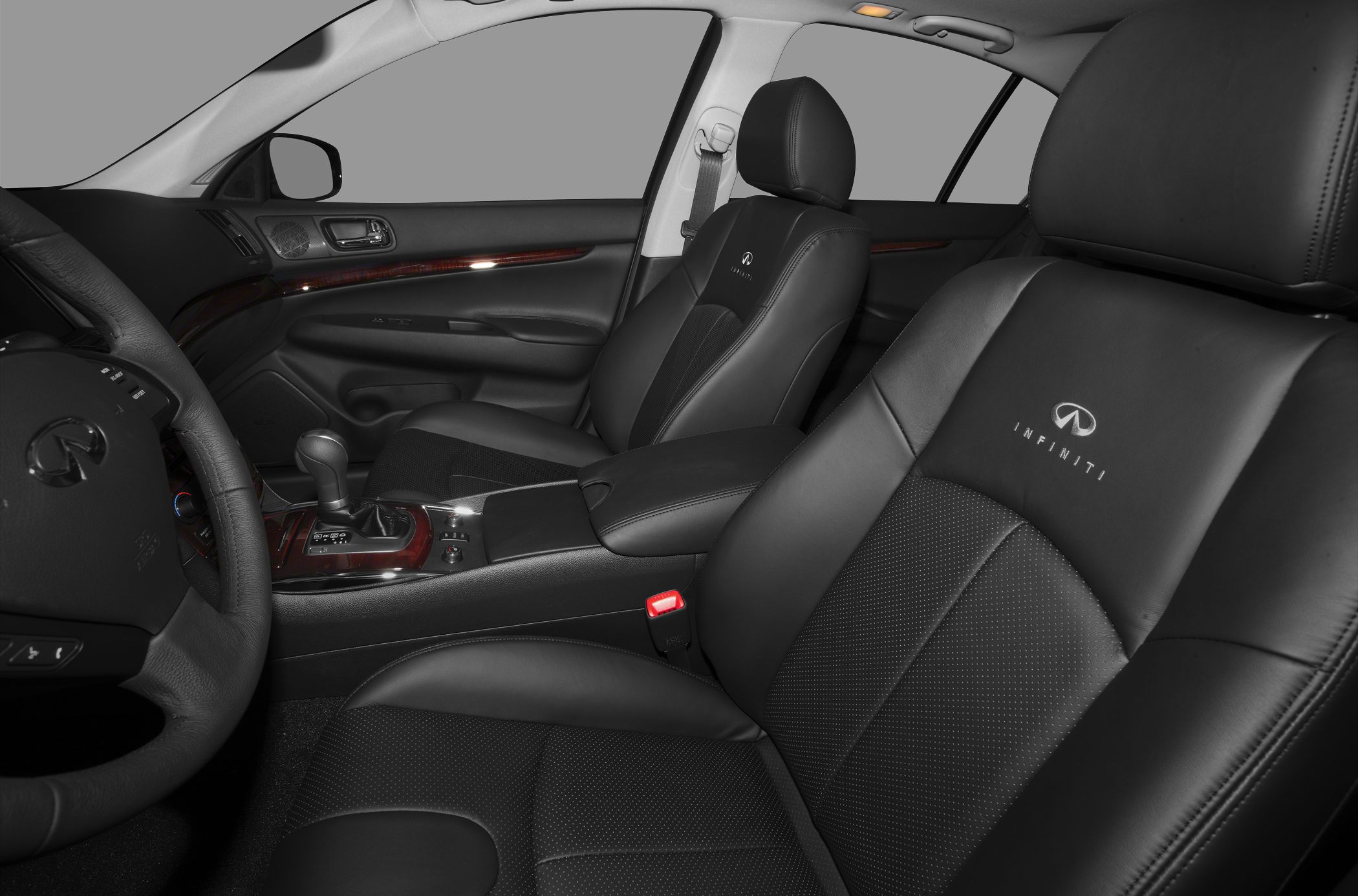 Black leather seats with Infiniti logo and wood trim interior