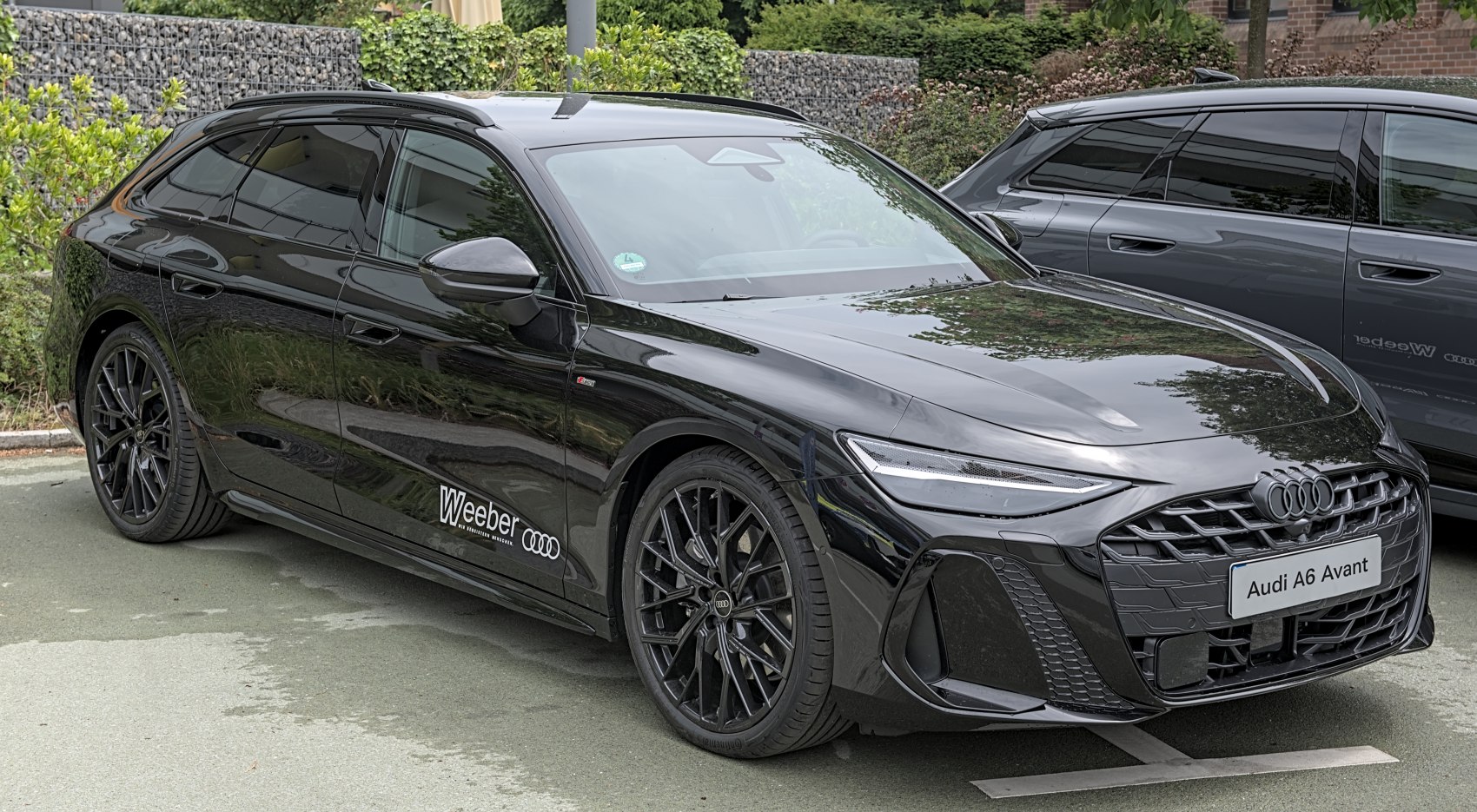 Black station wagon with sporty design and aggressive front grille
