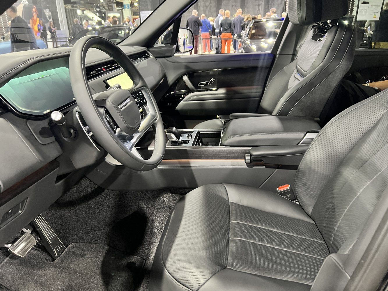 Luxury black leather seats with modern digital dashboard and steering wheel