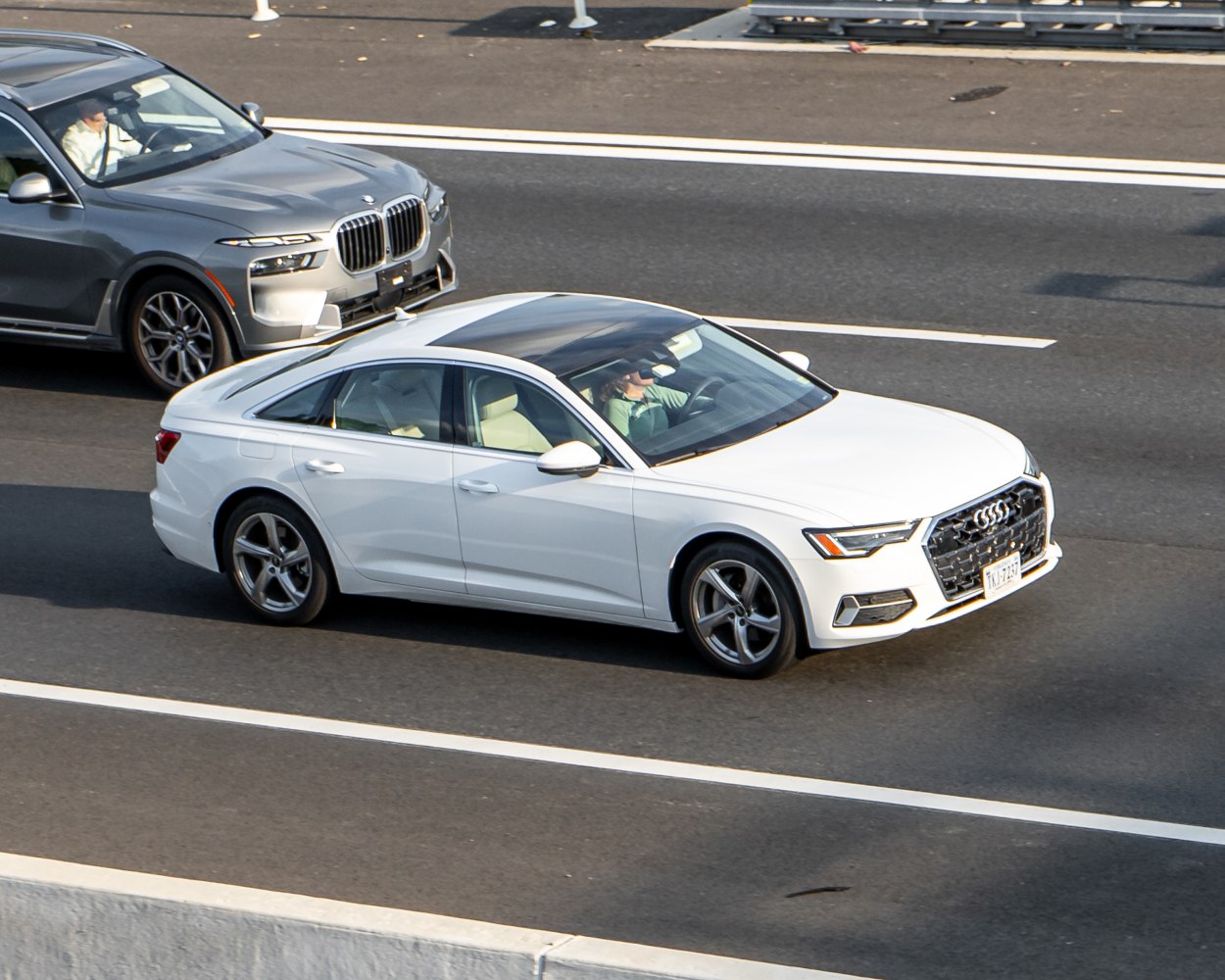 Luxury sedan with panoramic sunroof and sporty alloy wheels