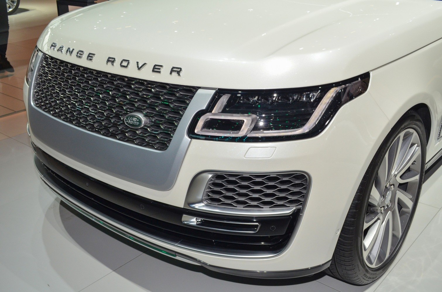 Close-up of luxury SUV front grille and LED headlight