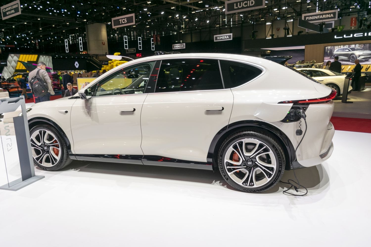 Electric SUV side view with rear charging port and alloy wheels