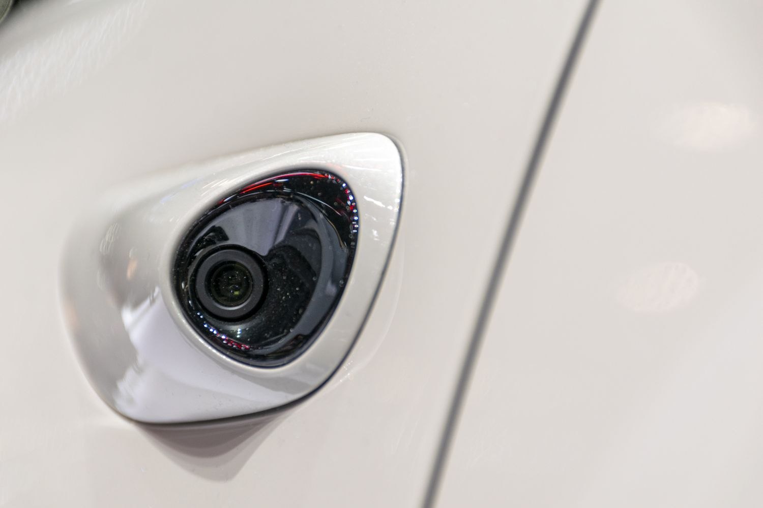 Close-up of aerodynamic side camera on vehicle door