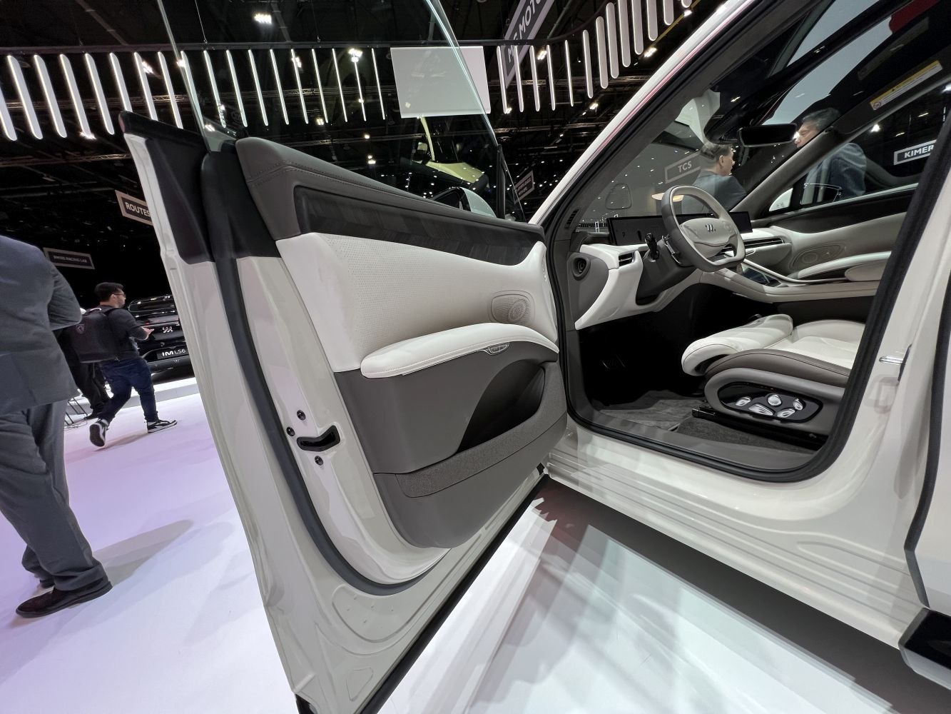 Interior door panel and front driver's seat with seat adjustment controls