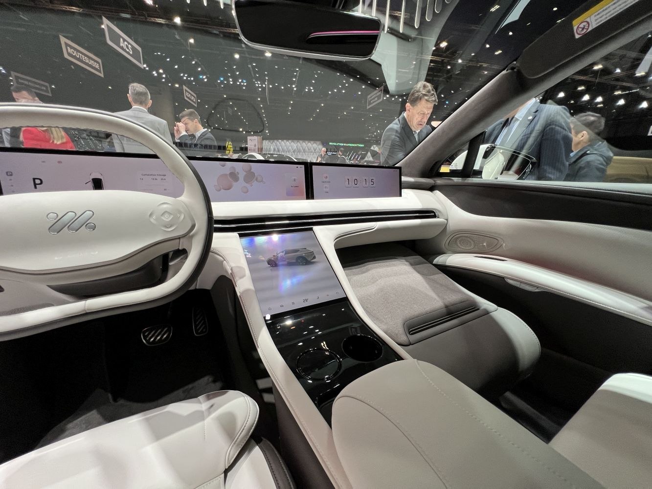 Futuristic digital dashboard and unique steering wheel in a modern car interior