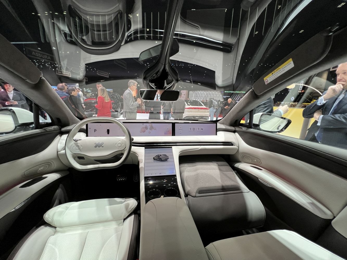 Minimalist cockpit with dual digital dashboard and center touchscreens