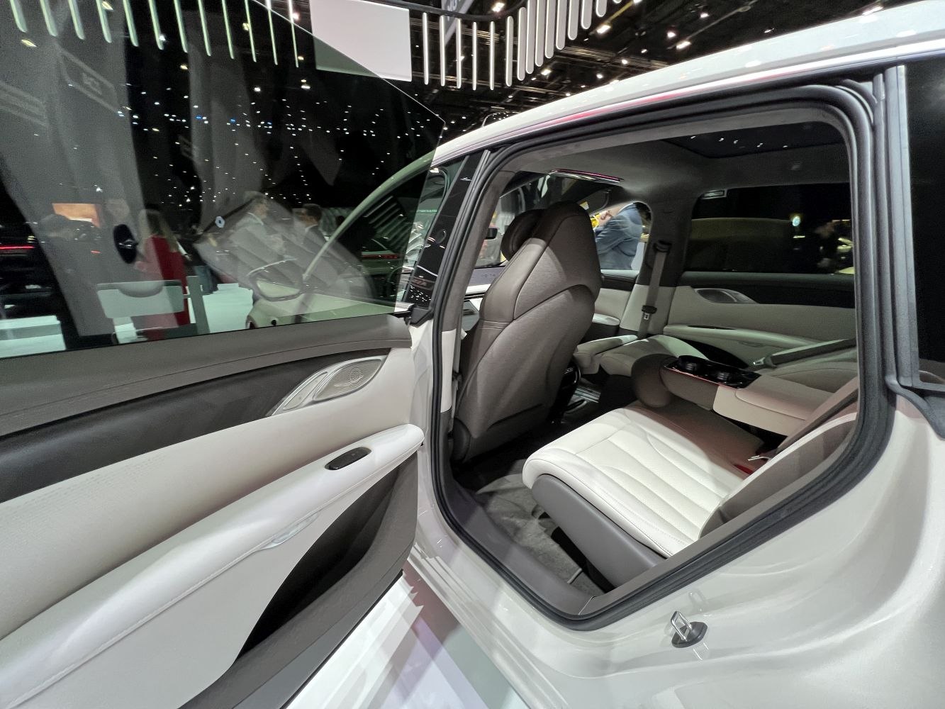 Open rear door showing luxury rear passenger seat and door panel