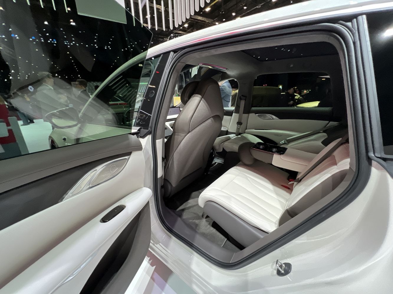 Luxury white leather rear seats with modern door panel details