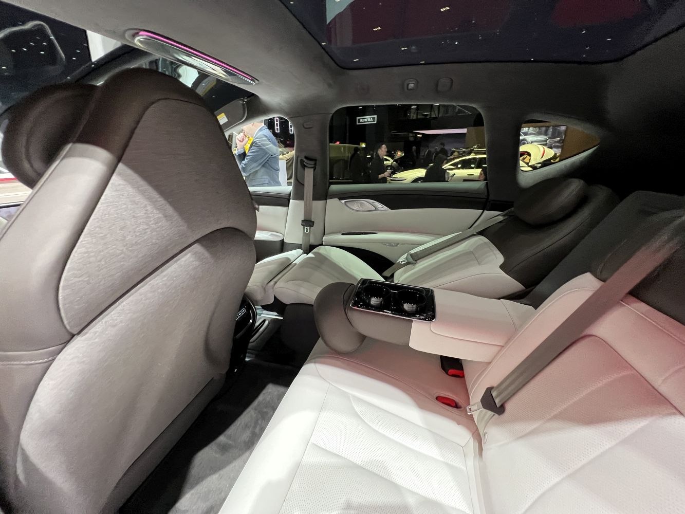 Luxury rear seat with fold-down armrest, cup holders, and panoramic roof