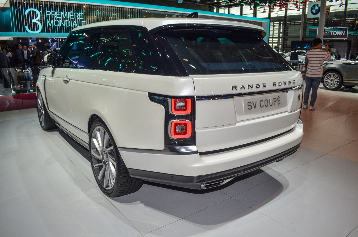 Rear view of luxury SUV with sleek taillights and sporty alloy wheels