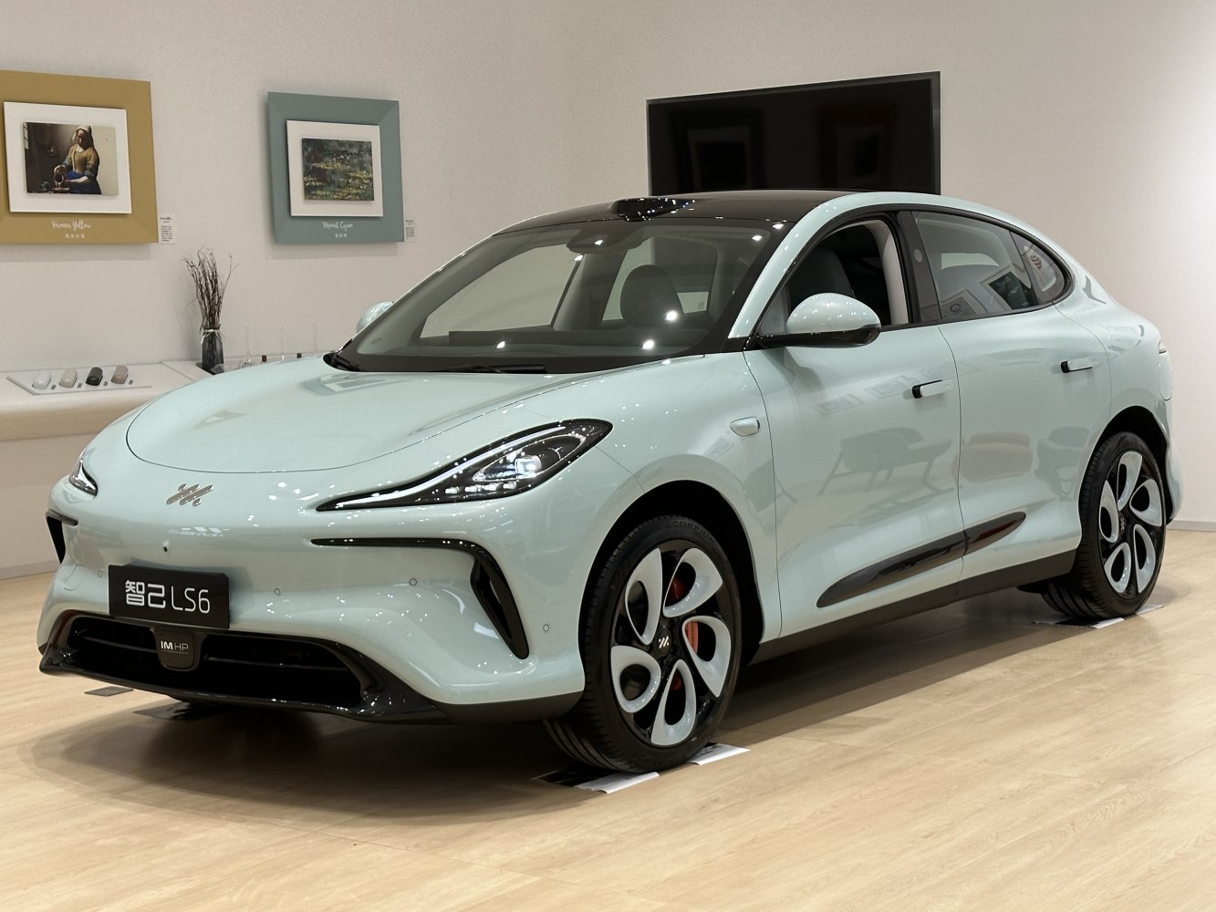 Sleek front-side view with unique headlights and futuristic wheels