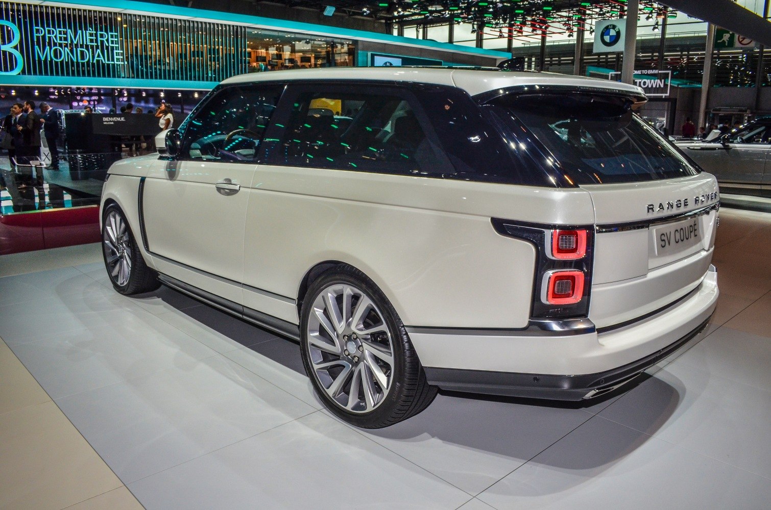 Rear three-quarter view with distinctive square LED tail lights and two-door coupe SUV design