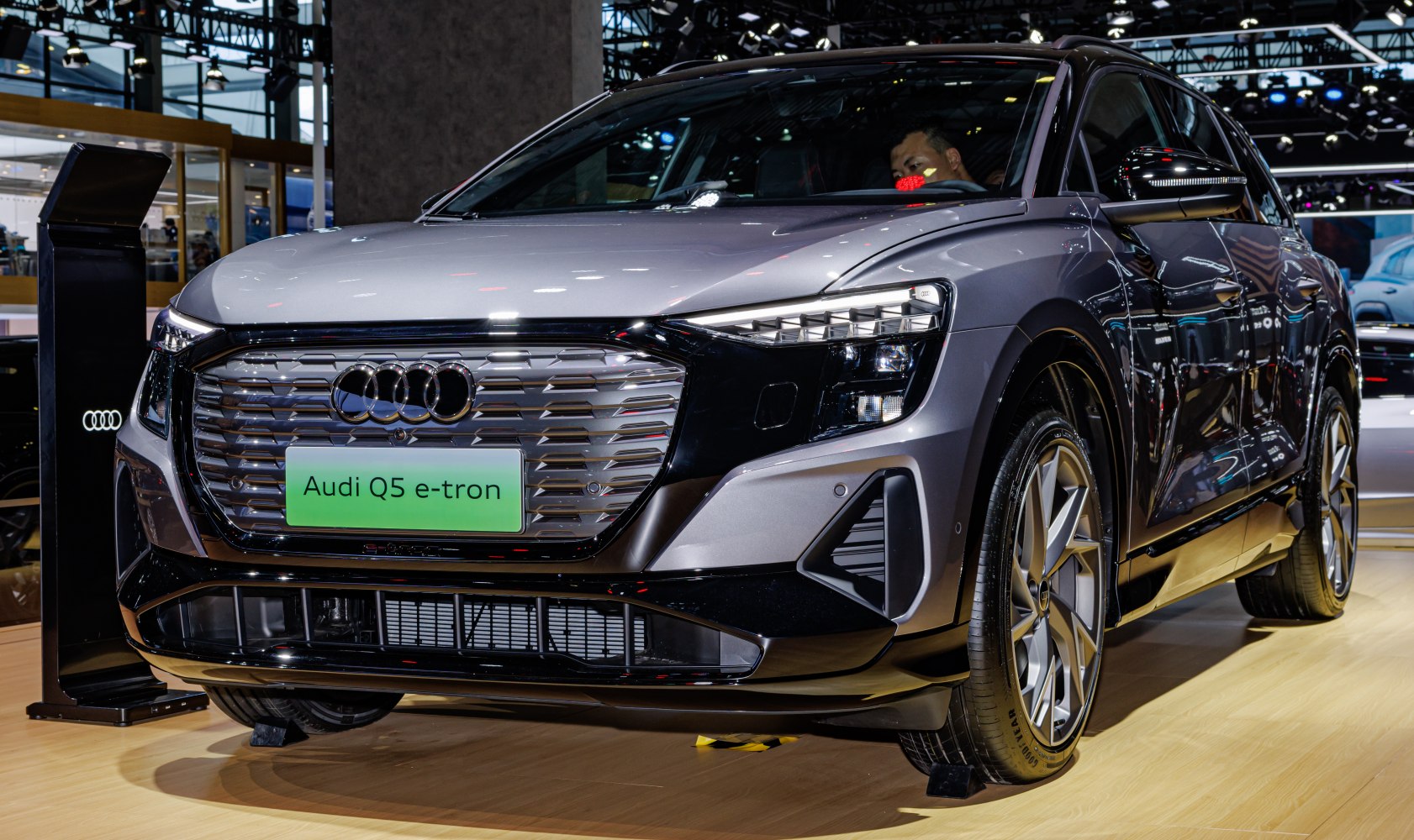 Close-up of front grille and LED headlights on electric SUV.