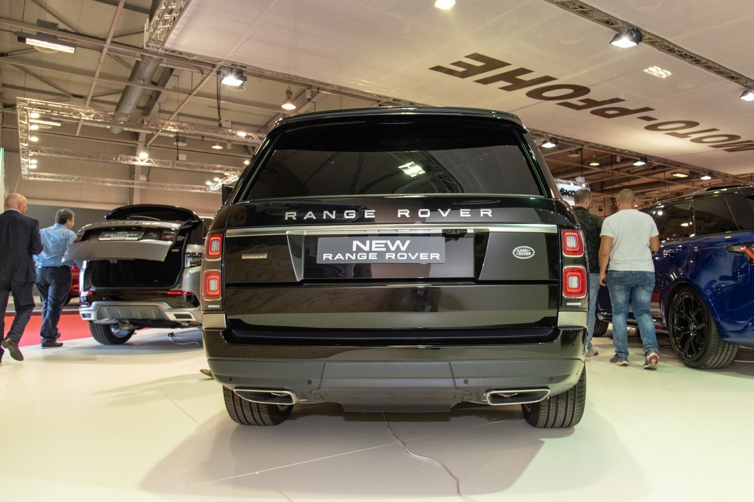 Rear view of modern luxury SUV with distinctive taillights and dual exhaust tips