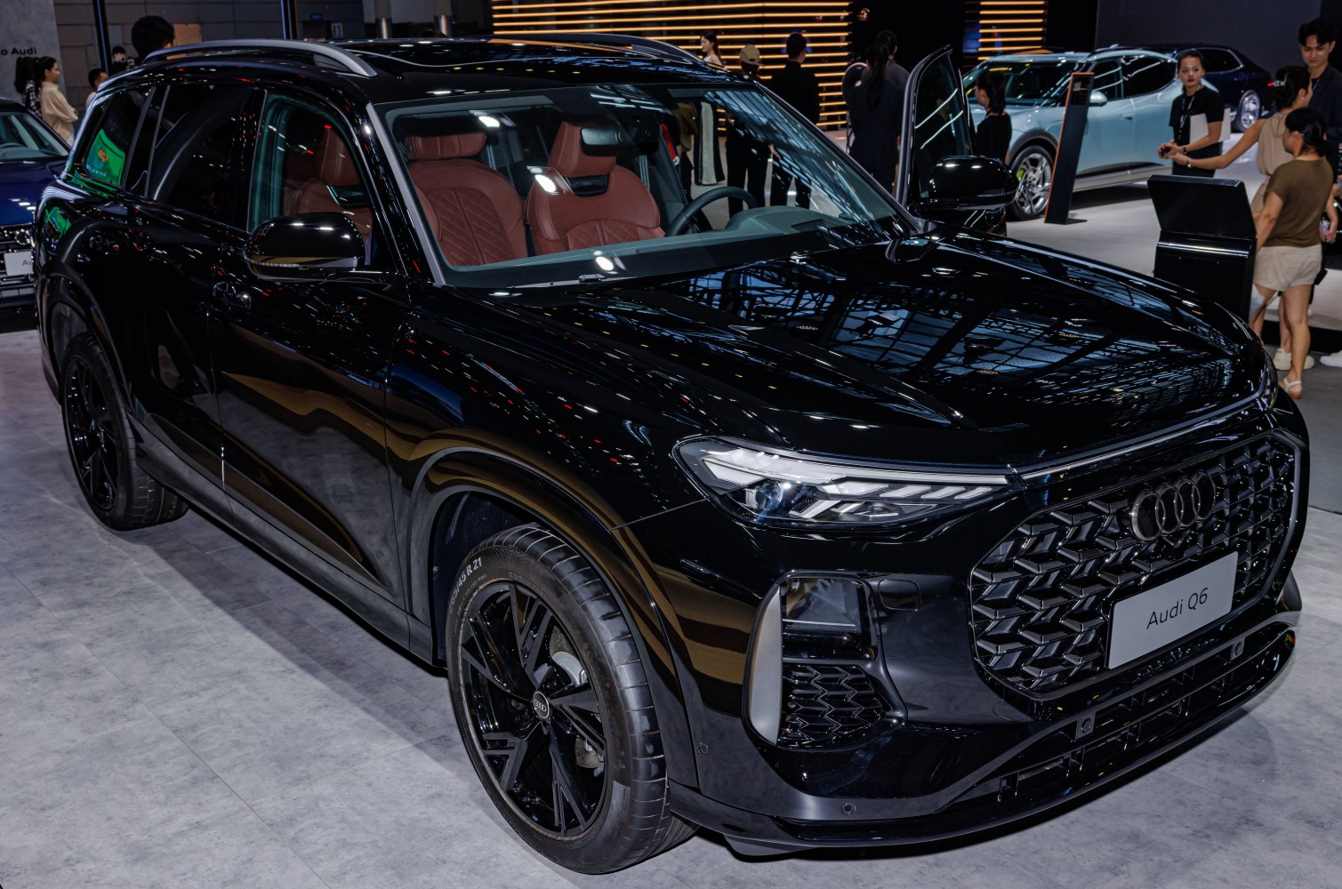 Black luxury SUV with LED headlights and brown leather interior