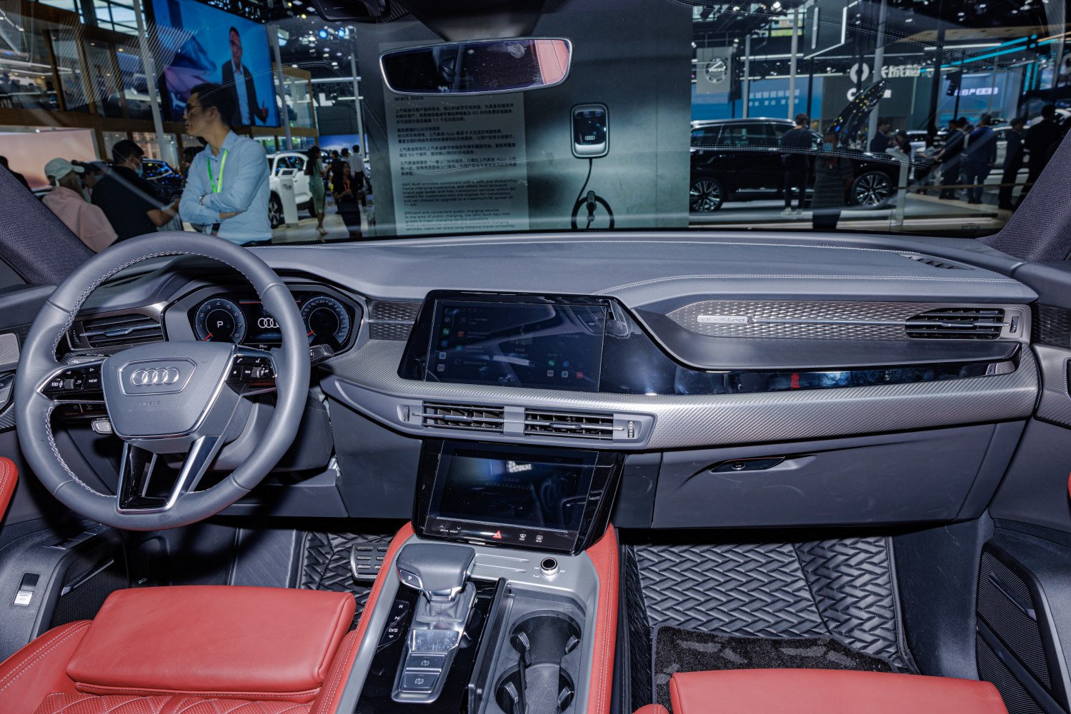 Modern dashboard with digital cluster and touchscreen in premium red leather interior